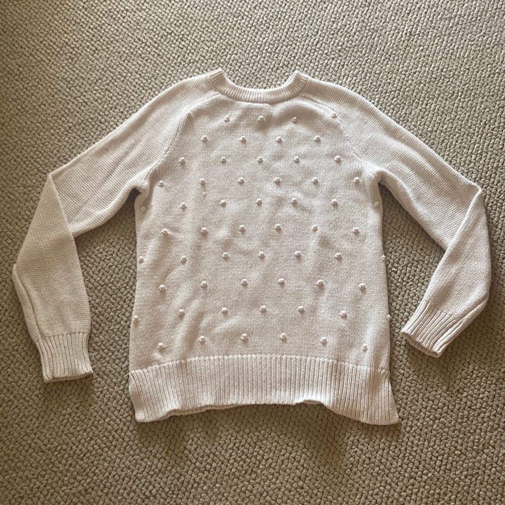 White sweater with fabric dots on the front, size XS